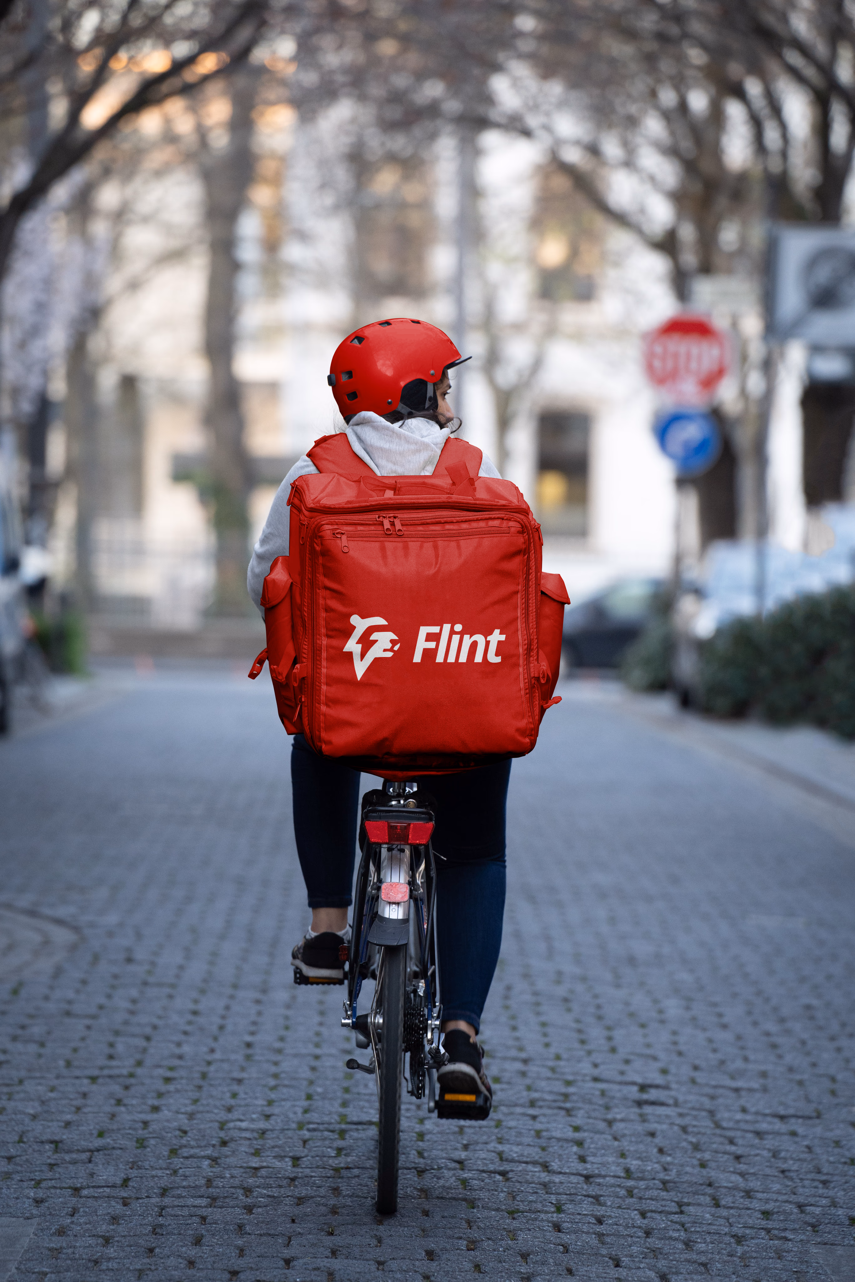 Delivery person riding bicycle